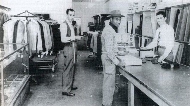 Crown Tailors at 408 E. Sixth St. circa 1950. Left is master tailor Eli Gonzales. Right is owner Hyman Samuelson. (Courtesy Austin History Center).